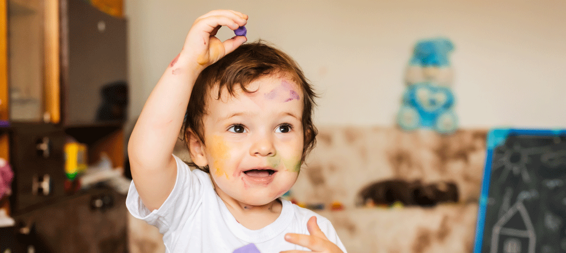 A child with paint on their face